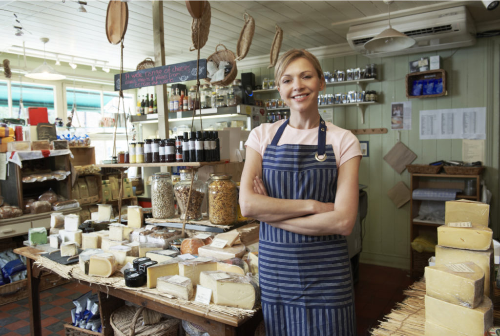 A business owner smiling at camera inside her recently opened business